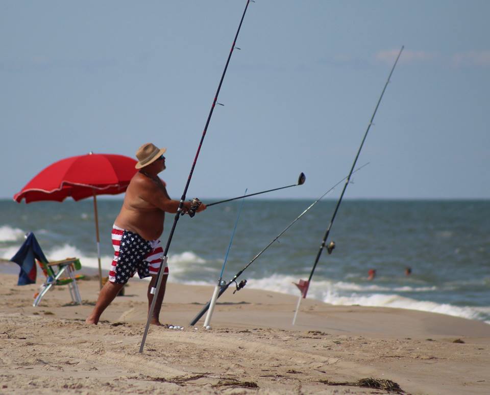 Hitting golf balls into the ocean.