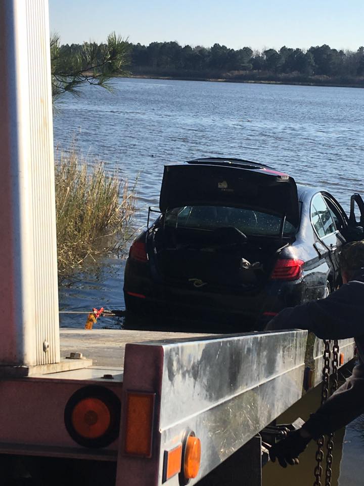 Pulling car onto a roll back flat bed Tow Boat US Indian River