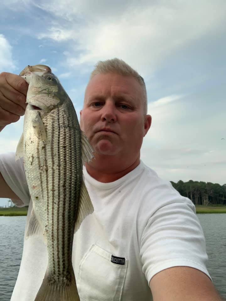Dave Eastburn smacking short striped bass near Masseys Ditch delaware