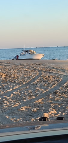 beached boat, the point, cape henlopen state park, parker boats