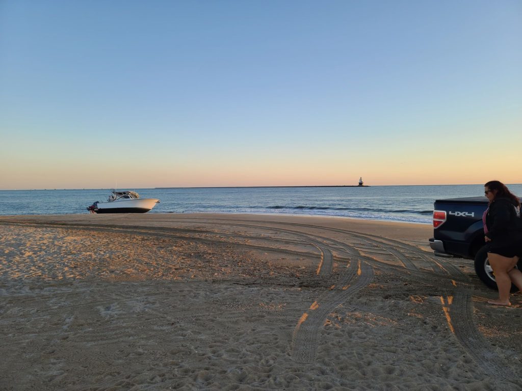 beached boat, the point, cape henlopen state park, parker boats