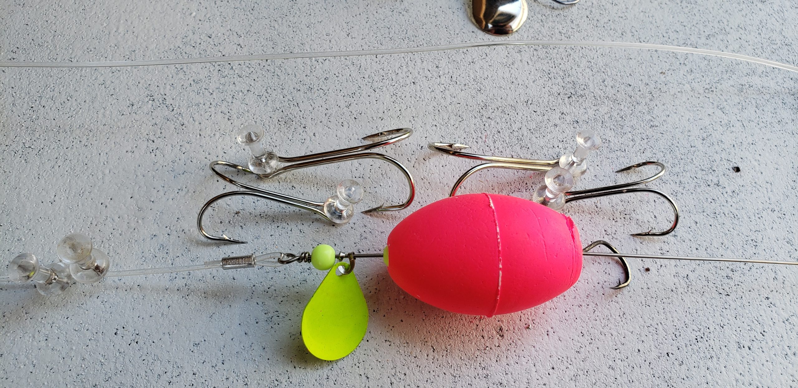 Mullet rig hooks pinned tot he board now too for easy access. - delaware-surf-fishing.com